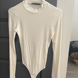 Naked wardrobe mock neck bodysuit